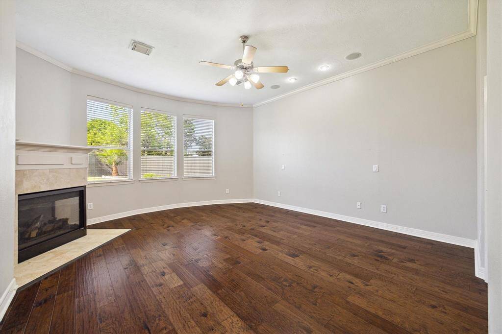 Oversize primary bedroom down w gas fire place & backyard views