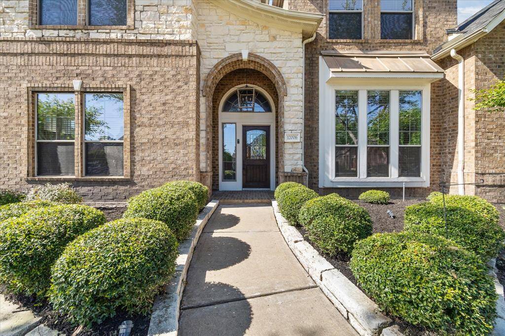 Covered front porch & mahogany front door