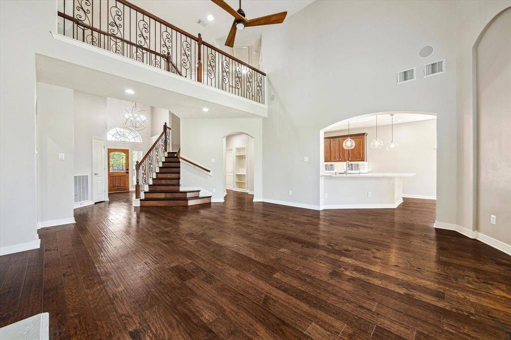 Open floorplan with interior balcony overlooking living areas