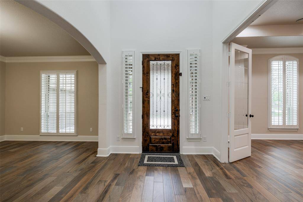 View of the entrance with adjacent study/office and formal dining.