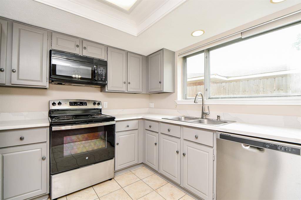 Stainless & black appliances. Range & dishwasher replaced 2022