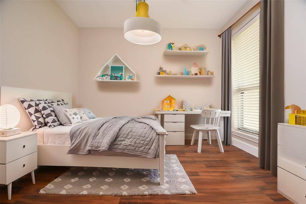 3rd bedroom. Flooring is ideal for playing with cars/trucks; no carpet.