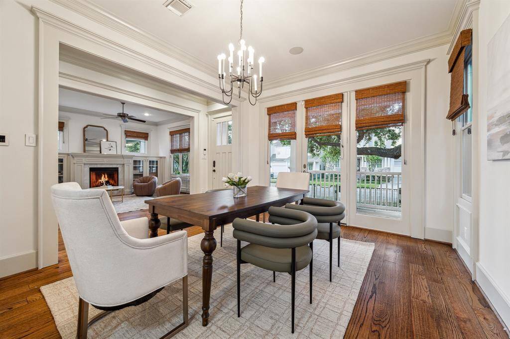 Indoor-outdoor entertaining is easy in this exceptional dining room, thanks to the adjacent butler’s pantry and French doors opening to the porch.