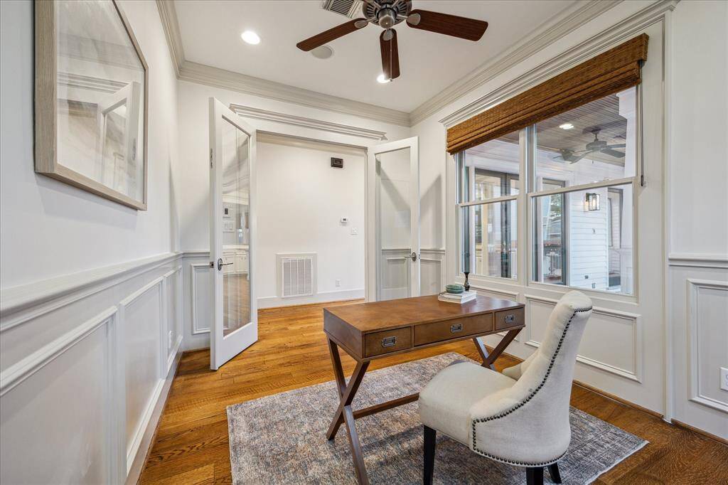 Bask in natural light all day in this inviting den, featuring views of the porch and pool, with beautiful southern exposure sunlight streaming in.