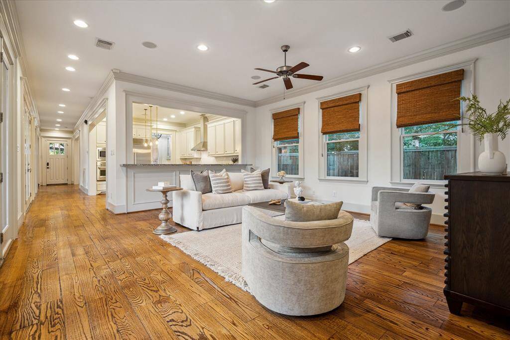 Past the kitchen, this extra-large family room features a ceiling fan, built-in speakers and a television mount, creating the perfect destination for cozy movie nights.
