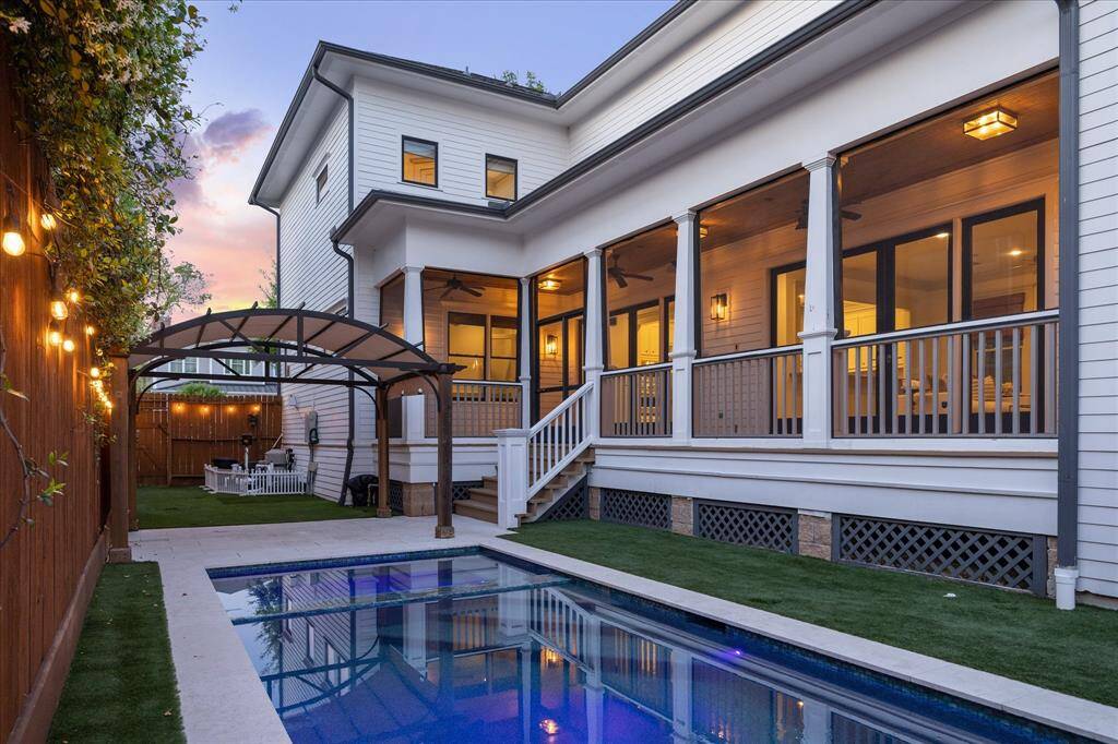 A gate provides convenient access from the side yard to the fenced front yard