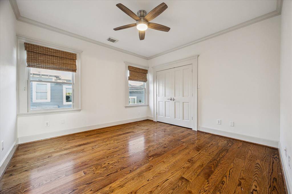 Two secondary bedrooms feature ceiling fans, large wall closets and pocket door access to a convenient Jack-and-Jill bathroom.
