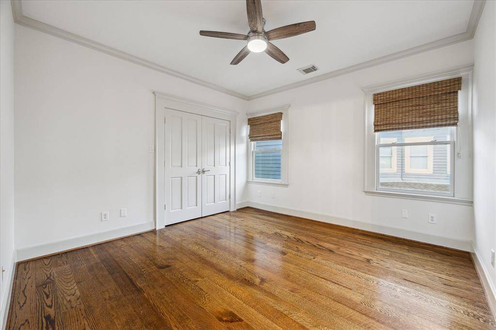 Two secondary bedrooms feature ceiling fans, large wall closets and pocket door access to a convenient Jack-and-Jill bathroom.