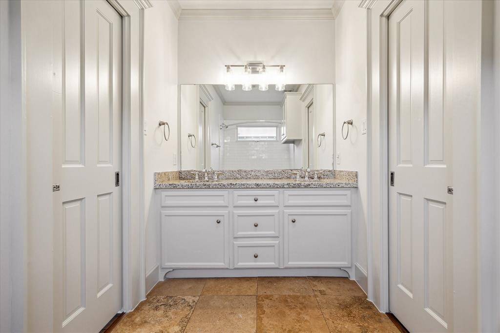 Busy mornings are easier with the Jack-and-Jill bathroom’s wide double vanity and generous storage.