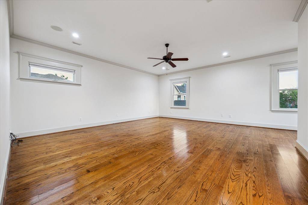 This sprawling fourth bedroom suite could easily accommodate two beds and a play area or be used as a large game room/playroom with a newer installed en-suite bathroom.