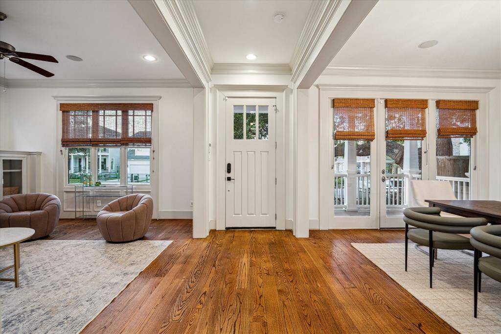 Inside this 4,025-square-foot residence, tall ceilings are trimmed with recessed lighting, double crown molding and brand-new, never-used integrated speakers. Freshly painted walls, classic millwork and engineered hardwood floors run throughout.