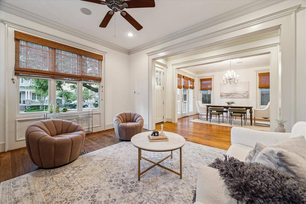 This versatile front room can be anything you need—whether it's a formal living room, downstairs game room, mahjong room, piano room, or your own creative space!