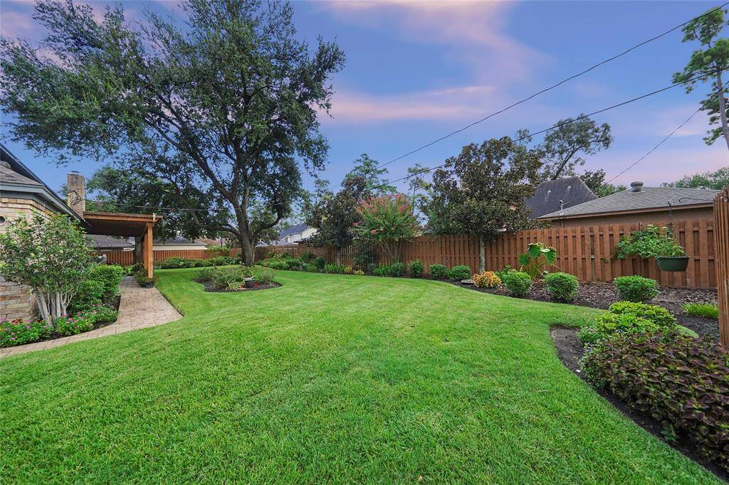 Massive double-lot backyard for relaxation and entertaining.