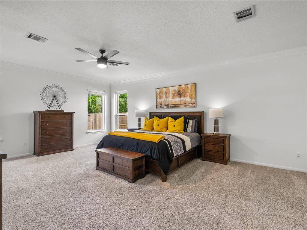 Step into your over-sized primary bedroom with an ample amount of natural light.