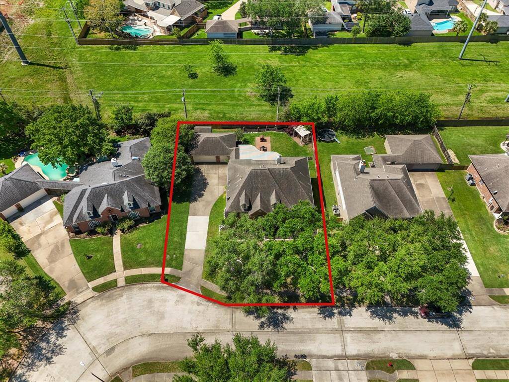 Large driveway, mature trees in the front, and a private backyard, plus no HOA!