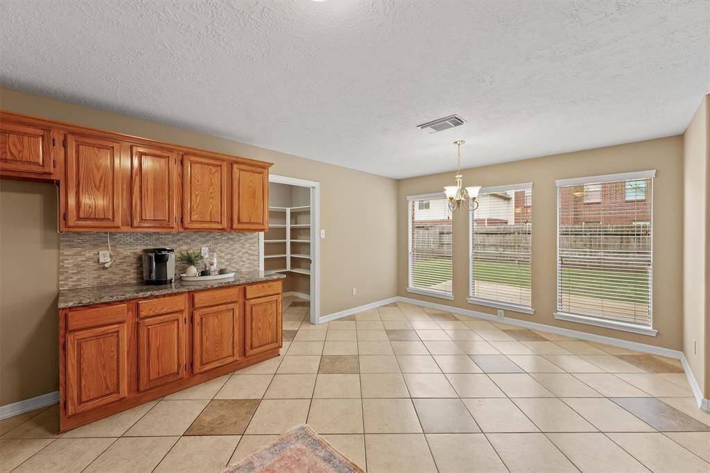 The kitchen connects to a good-sized breakfast room for casual dining.