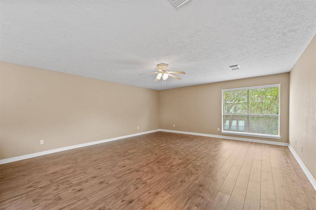 Upstairs, there's a really spacious game room – think movie nights, hobbies, or just a great place for the kids.