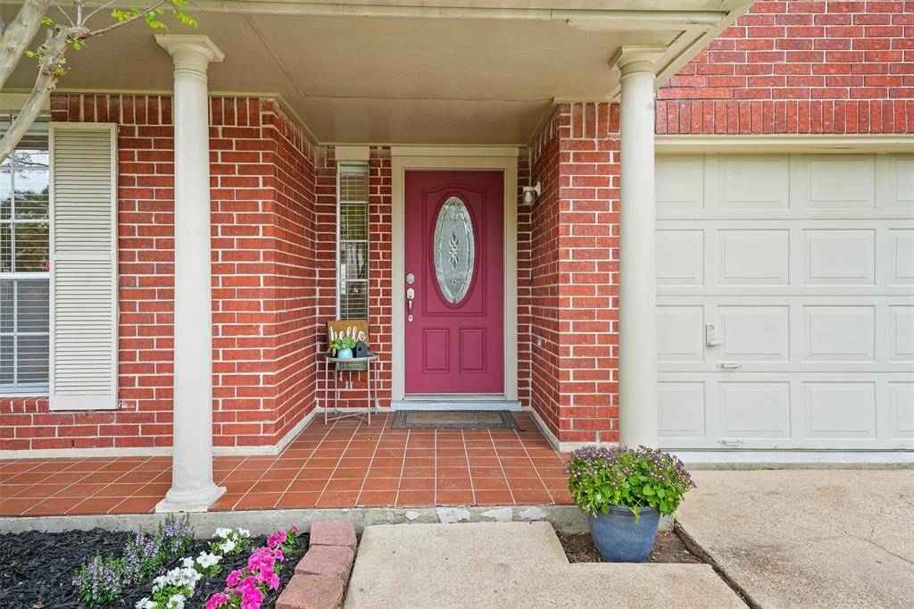 Tiled floor and room for seating under the welcoming covered porch
