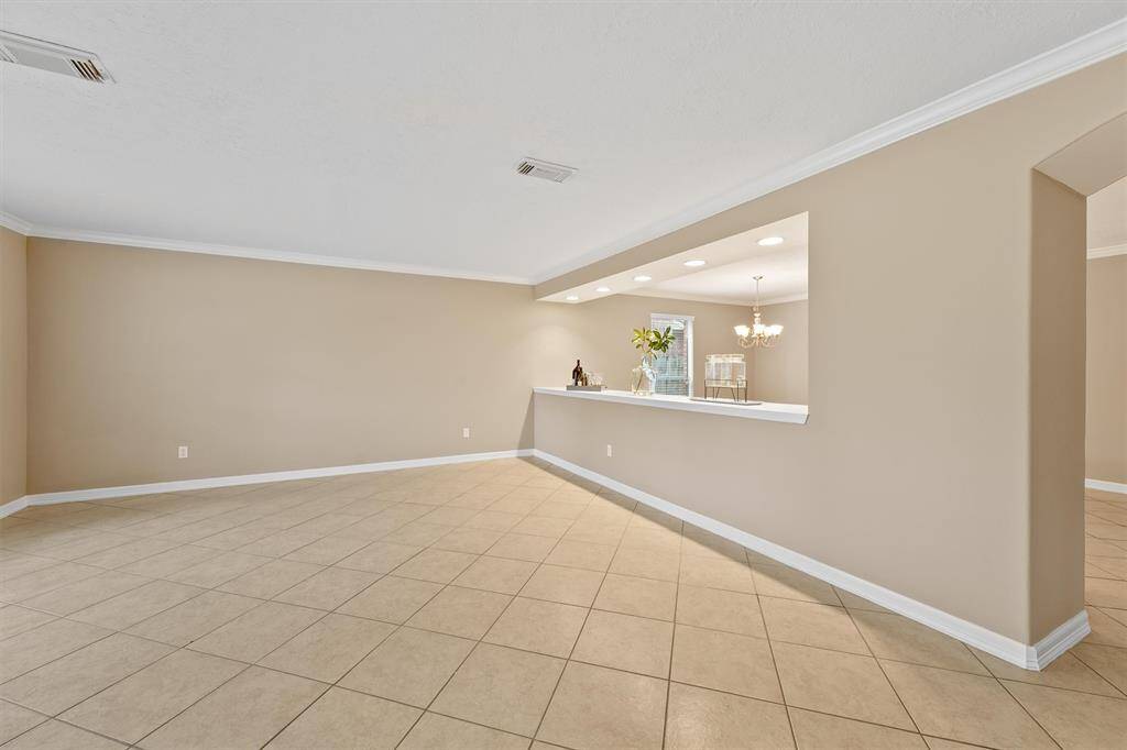 The downstairs is an entertainer's paradise, featuring a formal living room perfect for elegant cocktail parties