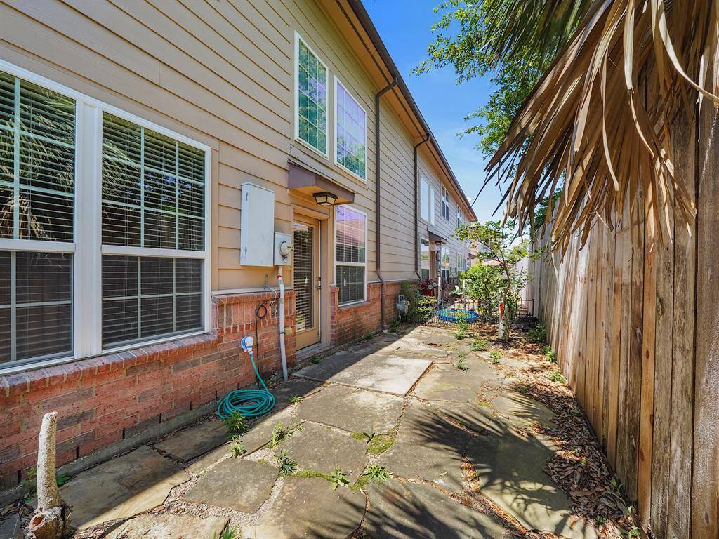 Garden area behind home. Fence maintained by HOA.