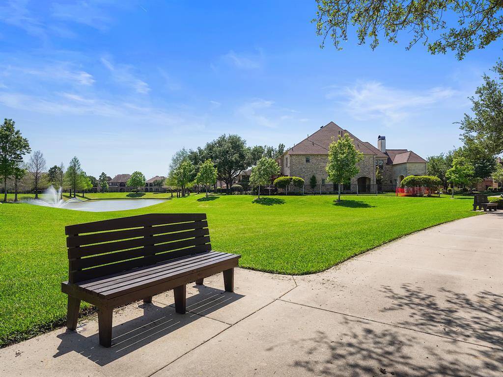 Neighborhood lake with benches and trail. Life here is waiting for you!