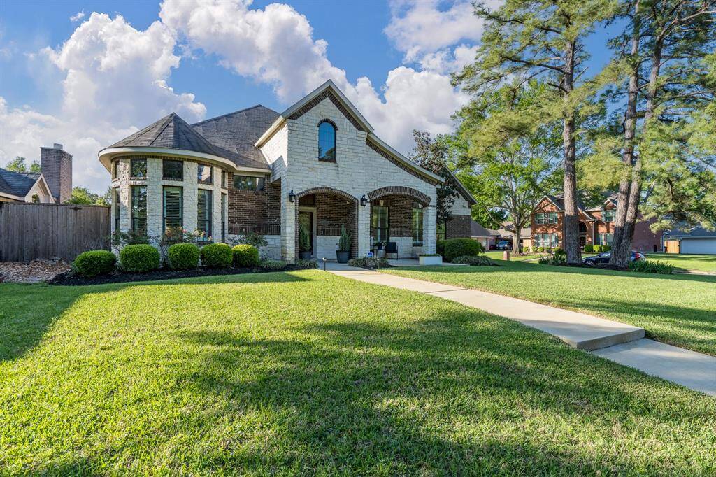 Beautifully crafted brick and stone exterior delivers stunning curb appeal and timeless charm.