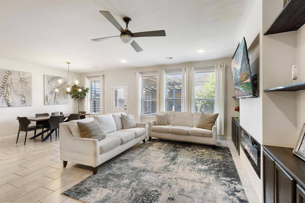 No shortage of natural light in this living area! This bright and airy living room creates the perfect setting for both relaxation and entertaining.