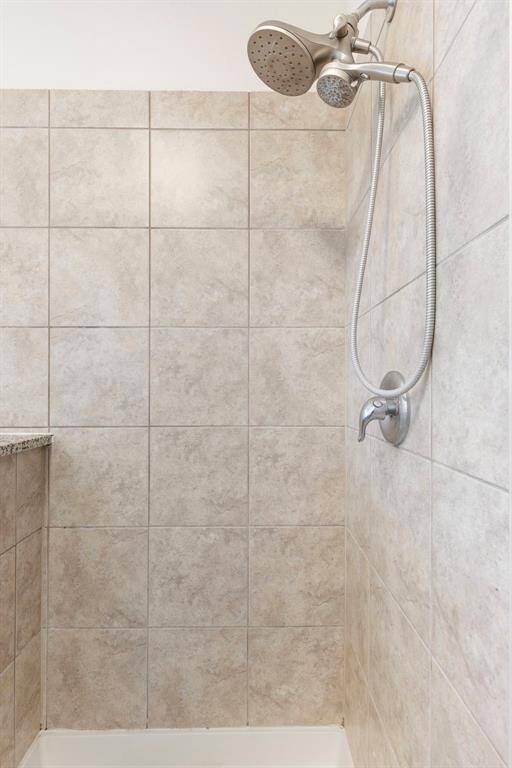 You will love the tiled walk-in shower with shower wand.