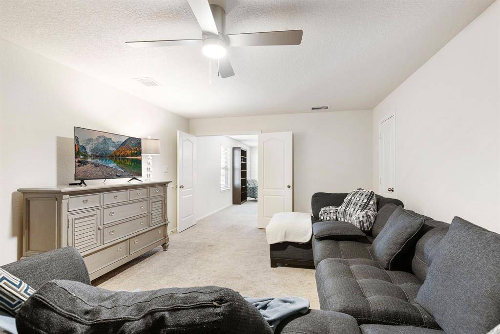 Enjoy movie nights and game days in this spacious media room, located upstairs right off the flex space, also featuring a storage closet.