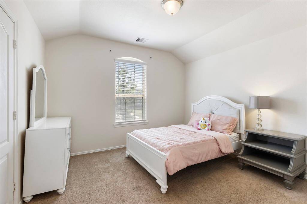 Light & bright secondary bedroom upstairs with a large walk in closet.