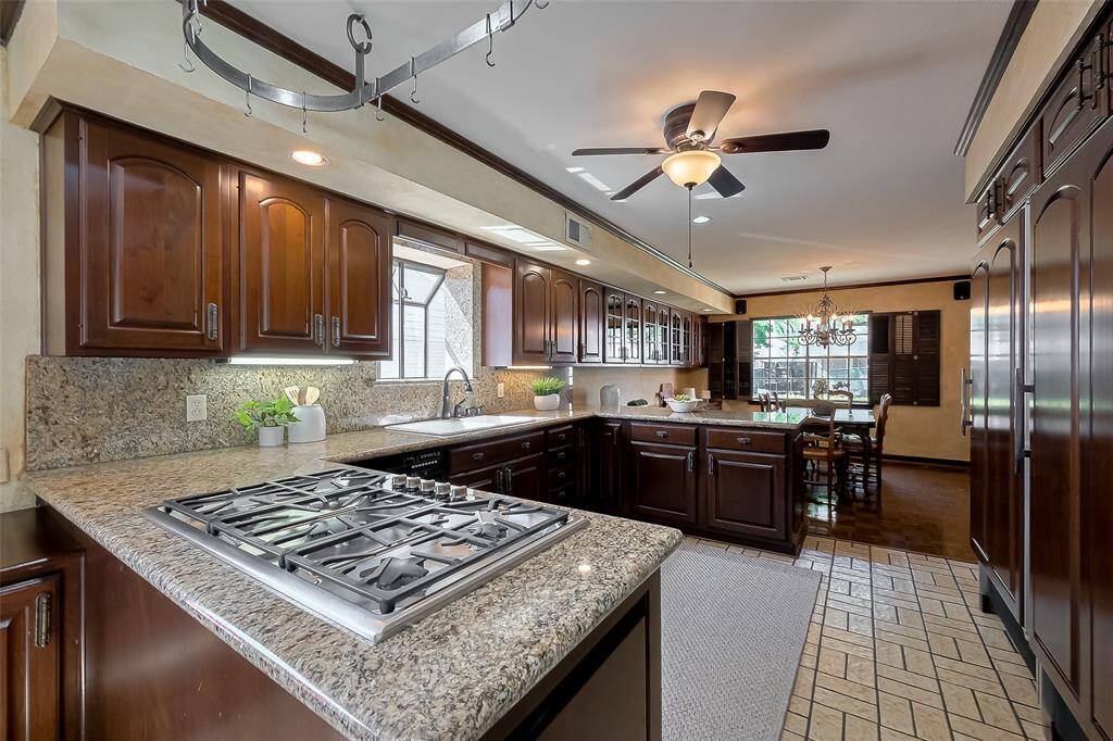 Gas cooktop and built in fridge and freezer.
