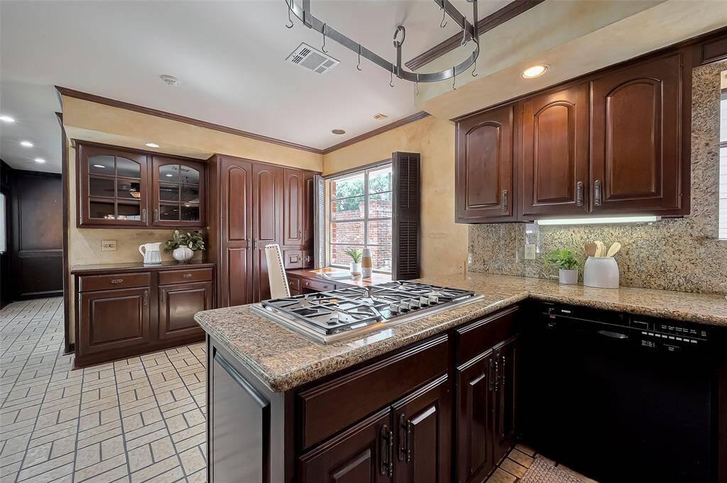Hallway to the left leads to a laundry room, 1/2 bath, and wine room.
