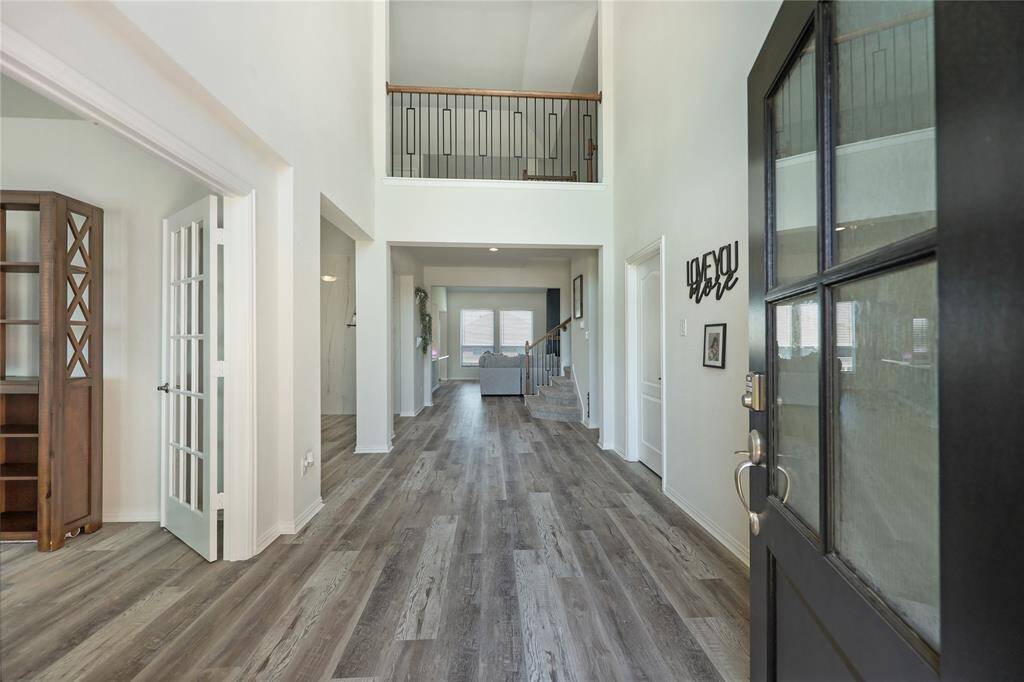 A stunning front door fills the entry with natural light while maintaining privacy.