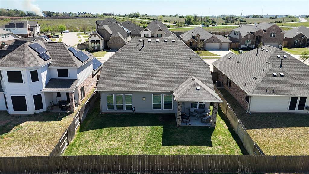 Privacy fence, covered porch, and a spacious backyard—perfect for relaxing or entertaining!