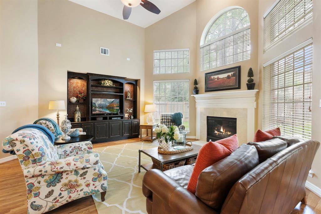 Large windows in the family room let in natural light. The fireplace makes it so cozy!