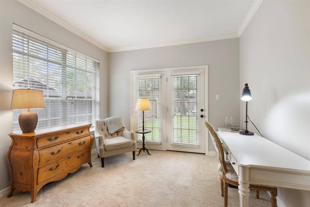 Seating area in the primary room. providing access to the backyard.