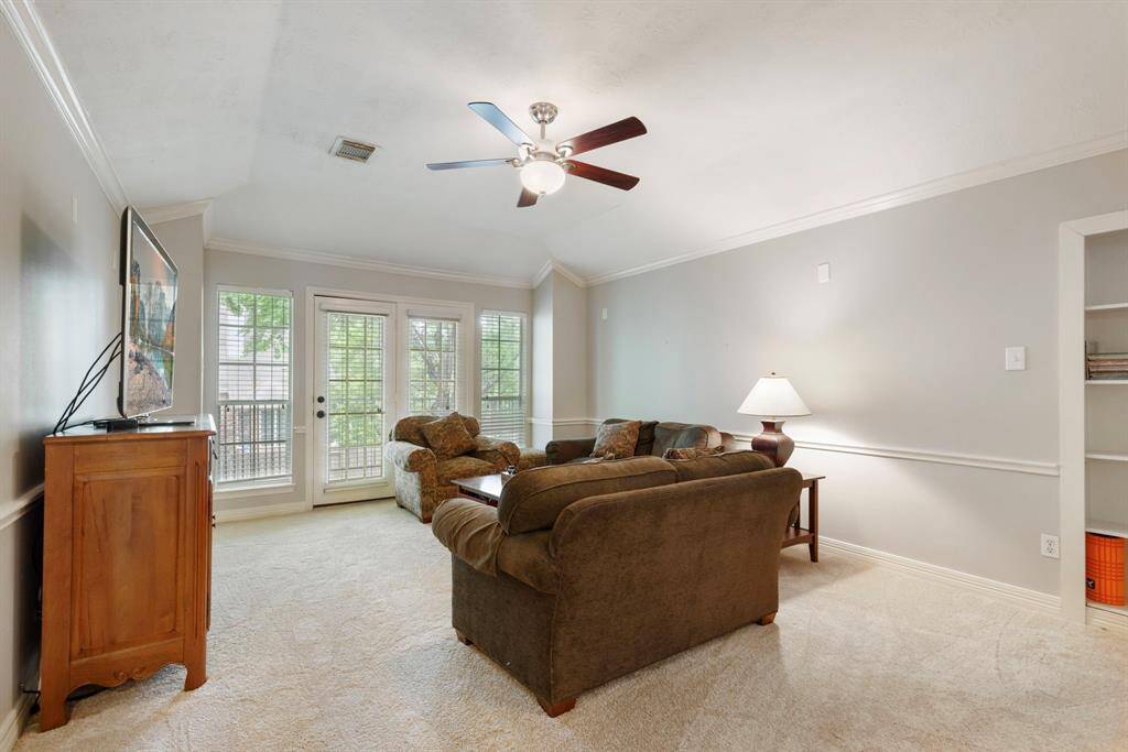 The game room has access to a balcony and to a walk-in attic.