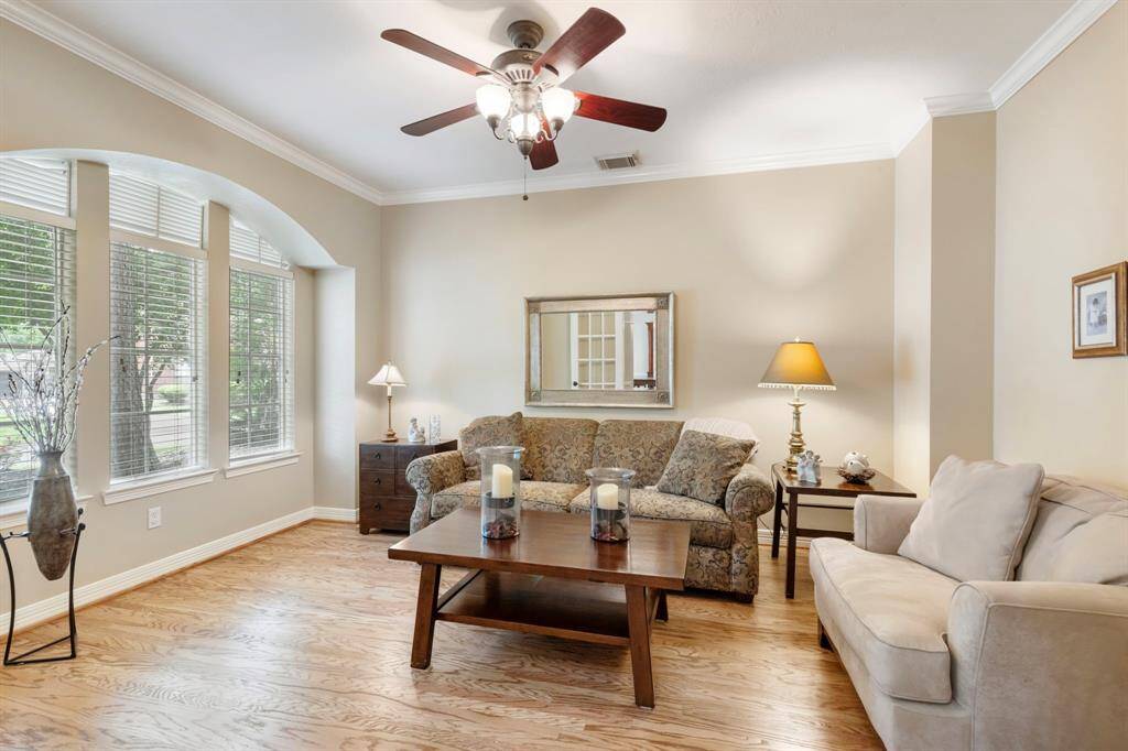 As you enter the home, on your left hand side is the very spacious home office, currently being used a a formal living room.
