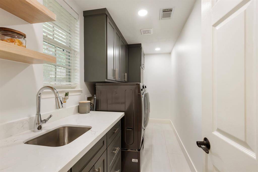 Lots of counter space and storage in this fully remodeled utility room.
