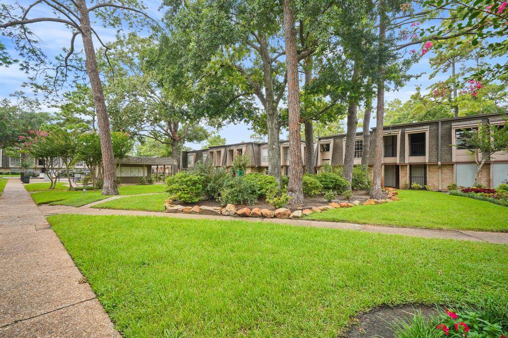 The open area in the condominium is AMAZINGLY gorgeous! This area displays tall and mature trees which provide a great amount of shade and it also includes well maintained lawn.