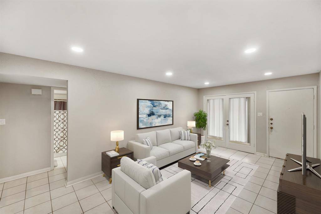 Virtually Staged: This lovely living room features recessed lighting, and tile floors.