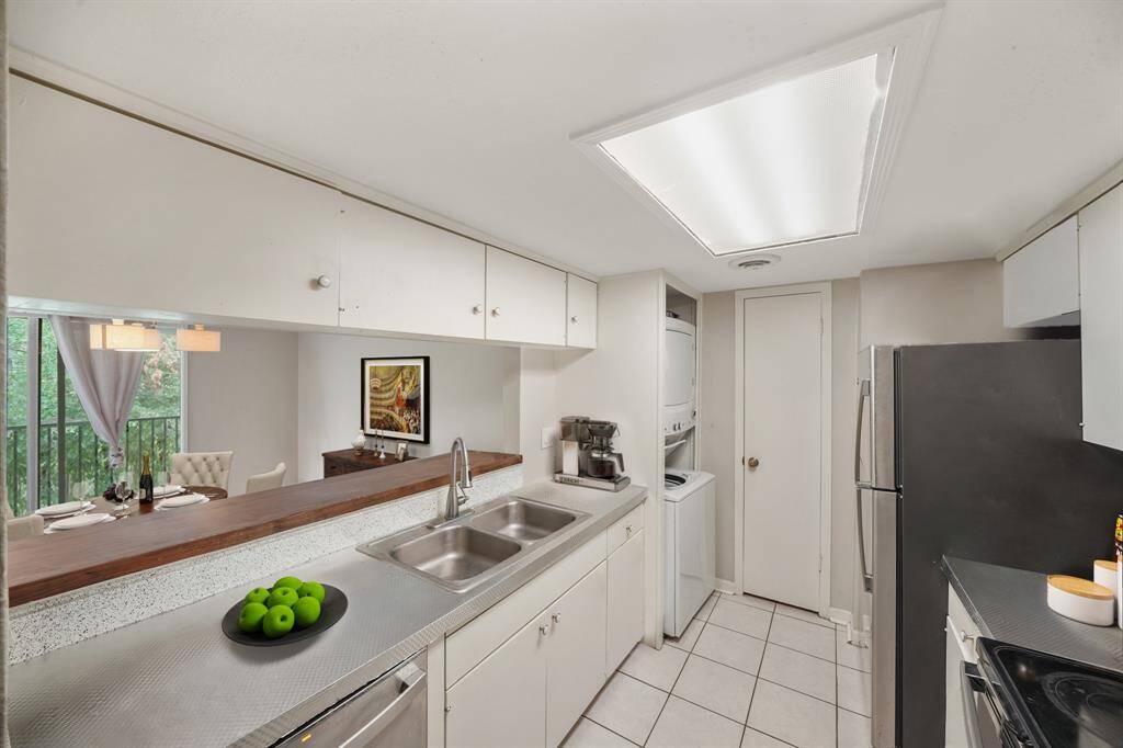 Virtually Staged: The kitchen is open to the dining area, providing a great entertainment space.