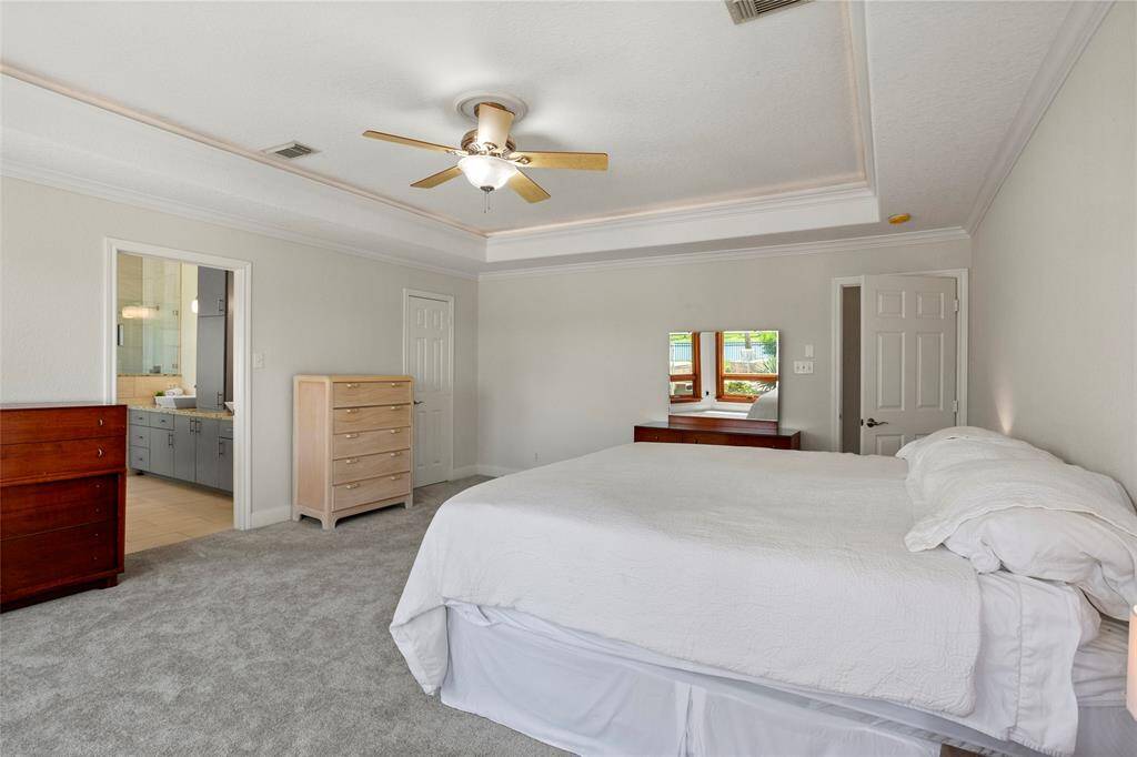 Enjoy the seamless connection between the primary bedroom and the ensuite bathroom.