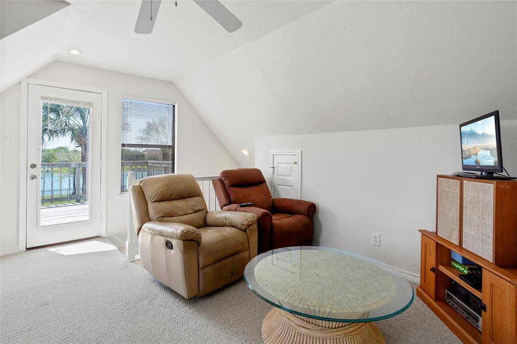 Enjoy stunning lake and backyard views from the cozy upstairs living room, or step onto the patio to savor breathtaking sunsets.