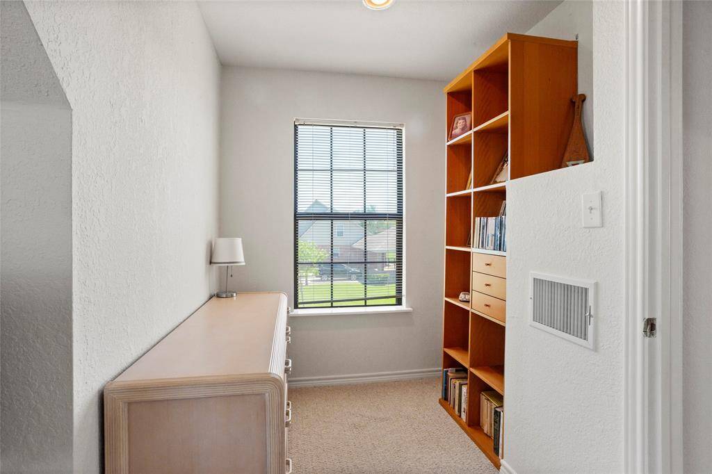 Cozy upstairs bedroom with a perfect spot for a desk or reading nook.