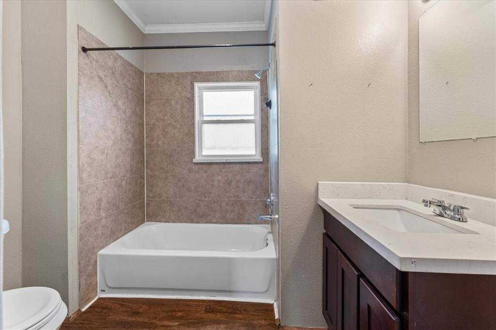 Unit A (triplex). The secondary bedroom has it's own separate entry. This room also provides lots of natural light and a closet.