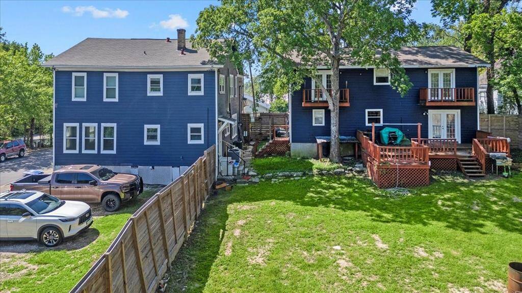 Rear of properties with large backyard that is fenced! Pet friendly and lots of extra room for parking!
