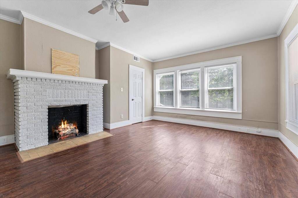 Unit A (triplex). Large and bright living room.
