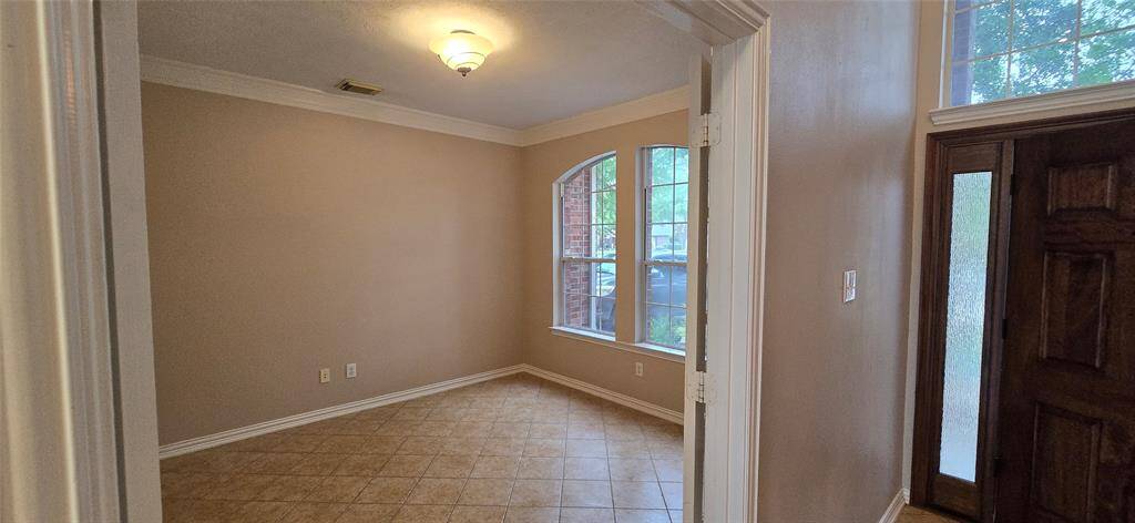 Bright office/study with French doors and large windows for natural light and privacy