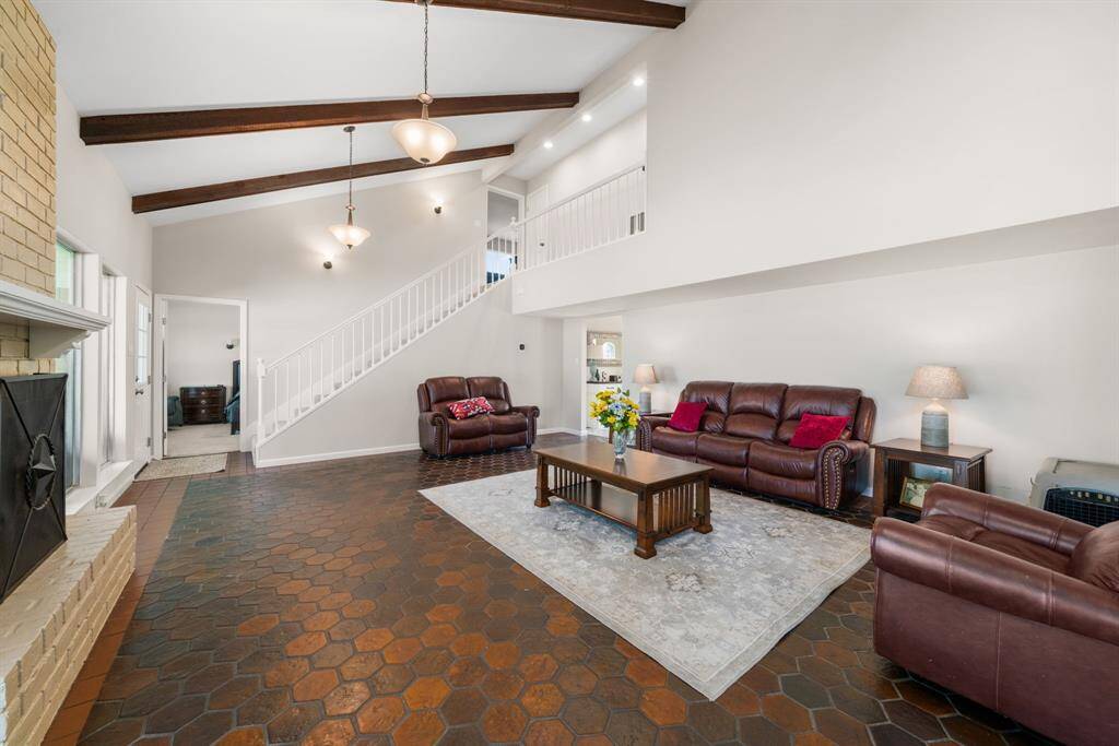 View of living room from breakfast room. Door to the left is the Master bedroom entry.